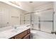 Clean bathroom features tub and shower combo with sliding glass doors at 3345 E University Dr # 73, Mesa, AZ 85213