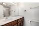 Bright bathroom featuring a white marble-look countertop and wood cabinetry at 3345 E University Dr # 73, Mesa, AZ 85213