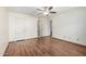 Bedroom with wood floors leads to closet and bathroom at 3345 E University Dr # 73, Mesa, AZ 85213