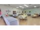 A spacious event room is decorated with multiple tables and chairs and floral arrangements for any occasion at 3345 E University Dr # 73, Mesa, AZ 85213