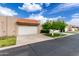 Charming single-story home with a white garage door and a well-manicured front yard at 3345 E University Dr # 73, Mesa, AZ 85213