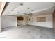 Spacious garage with white walls, concrete floor, and storage cabinets; ready for parking and projects at 3345 E University Dr # 73, Mesa, AZ 85213
