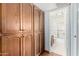 Hallway cabinets lead to a clean bathroom with tub and shower combo at 3345 E University Dr # 73, Mesa, AZ 85213