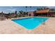 Sparkling community pool with ladders and a spacious deck, perfect for swimming and soaking up the sun at 3345 E University Dr # 73, Mesa, AZ 85213