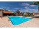 Inviting community swimming pool with clear blue water, surrounded by a spacious deck and comfortable lounge chairs at 3345 E University Dr # 73, Mesa, AZ 85213