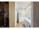 This modern bathroom features updated vanity and a tub with shower at 34195 N Alison Dr, San Tan Valley, AZ 85144