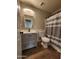 Bathroom featuring a vanity with a mirror, toilet, and shower with a gray-and-white striped curtain at 34195 N Alison Dr, San Tan Valley, AZ 85144