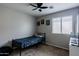 bedroom with a single bed, a ceiling fan and a window at 34195 N Alison Dr, San Tan Valley, AZ 85144