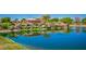 Scenic view of the San Tan Heights community entrance with a pond and lush landscaping at 34195 N Alison Dr, San Tan Valley, AZ 85144