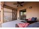 Relaxing covered patio features a sliding door, shade screen, and comfortable seating at 34195 N Alison Dr, San Tan Valley, AZ 85144