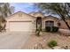 Charming single Gathering home featuring a neutral paint palette, landscaping, and attached two car garage at 34195 N Alison Dr, San Tan Valley, AZ 85144