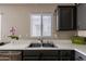 The kitchen features a stainless double sink with white countertops and grey cabinets at 34195 N Alison Dr, San Tan Valley, AZ 85144