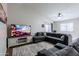 Spacious living room with vaulted ceilings, large sectional sofa, and sliding glass doors at 34195 N Alison Dr, San Tan Valley, AZ 85144