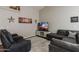 Comfortable living room featuring a large sectional sofa, a television and an area rug at 34195 N Alison Dr, San Tan Valley, AZ 85144