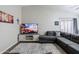 Living room features a comfortable sectional sofa, a television and neutral walls at 34195 N Alison Dr, San Tan Valley, AZ 85144