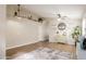 Bright living room with stylish decor, wood-look floors, ceiling fan, and decorative shelves at 34195 N Alison Dr, San Tan Valley, AZ 85144
