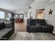 Spacious living room featuring wood floors, comfortable seating, and an open layout at 34195 N Alison Dr, San Tan Valley, AZ 85144