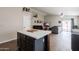 Open-concept floor plan seamlessly connects the kitchen island to the spacious living area at 34195 N Alison Dr, San Tan Valley, AZ 85144