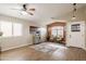 Spacious living room with wood-look floors, modern lighting, neutral paint, and comfortable seating at 34195 N Alison Dr, San Tan Valley, AZ 85144