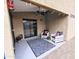 Cozy covered patio featuring outdoor seating, string lights, and access to the backyard at 34195 N Alison Dr, San Tan Valley, AZ 85144