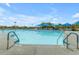 A refreshing swimming pool with clear blue water and convenient access steps for easy entry and exit at 34195 N Alison Dr, San Tan Valley, AZ 85144