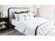 Bedroom with tufted headboard, stylish bedding, throw pillows and carpet at 3500 N Hayden Rd # 2103, Scottsdale, AZ 85251