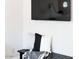 Bench with pillows and throw blanket underneath a wall-mounted television at 3500 N Hayden Rd # 2103, Scottsdale, AZ 85251