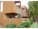 Modern condo building with desert landscaping, balconies, and exterior stairway at 3500 N Hayden Rd # 2103, Scottsdale, AZ 85251