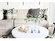 Close-up of a stylish sectional and coffee table, adorned with decorative items and pillows at 3500 N Hayden Rd # 2103, Scottsdale, AZ 85251