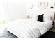 Serene main bedroom with a cozy bed, stylish bedding, and soft lighting for restful nights at 3500 N Hayden Rd # 2103, Scottsdale, AZ 85251