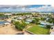 Wide aerial shot of a charming community with lush green landscapes, pools, and single-Gathering homes under a partly cloudy sky at 370 E Redfield Rd, Chandler, AZ 85225