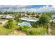 Expansive aerial shot showing the home's pool, mature trees, and overall landscaping in the backyard at 370 E Redfield Rd, Chandler, AZ 85225