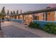Back of house with large windows allowing light inside, on a patterned patio at 370 E Redfield Rd, Chandler, AZ 85225