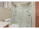 This bathroom has a glass enclosed shower with a sliding door, tiled flooring and walls at 370 E Redfield Rd, Chandler, AZ 85225