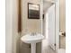 Bathroom with a pedestal sink, tile floors, and a view into attached room at 370 E Redfield Rd, Chandler, AZ 85225