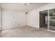 This bedroom has carpet flooring, baseboard trim and leads to an outdoor patio at 370 E Redfield Rd, Chandler, AZ 85225