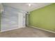 This bedroom has an accent wall with a cloud design and a walk-in closet at 370 E Redfield Rd, Chandler, AZ 85225