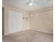 This bedroom has closet doors, carpet flooring, baseboard trim and a shelf at 370 E Redfield Rd, Chandler, AZ 85225