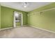 This carpeted bedroom has baseboard trim, a shelf, and a window with curtains at 370 E Redfield Rd, Chandler, AZ 85225