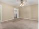 Bedroom featuring neutral walls, carpet, ceiling fan, and a large walk-in closet at 370 E Redfield Rd, Chandler, AZ 85225