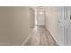 Inviting entryway with wood-look floors, white trim, and a front door with decorative glass at 370 E Redfield Rd, Chandler, AZ 85225