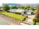 Aerial view showcasing a well-manicured lawn and gated yard, highlighting the home's curb appeal and inviting exterior at 370 E Redfield Rd, Chandler, AZ 85225