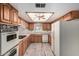 Kitchen features wooden cabinetry, white countertops, and modern appliances at 370 E Redfield Rd, Chandler, AZ 85225