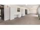 Open and airy room with carpet, natural light, and plenty of built in storage cabinets at 370 E Redfield Rd, Chandler, AZ 85225