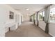 Spacious room with carpet, many windows providing natural light, and built-in cabinets at 370 E Redfield Rd, Chandler, AZ 85225
