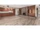 Spacious living room with fireplace, built-ins, and wood-look flooring at 370 E Redfield Rd, Chandler, AZ 85225
