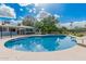 Backyard pool with blue sky, diving board and slide, surrounded by trees at 370 E Redfield Rd, Chandler, AZ 85225