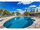 Backyard pool with slide, metal fence, and clear blue skies for ultimate relaxation at 370 E Redfield Rd, Chandler, AZ 85225