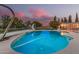 Sparkling pool with diving board and slide, set against a stunning sunset sky at 370 E Redfield Rd, Chandler, AZ 85225