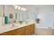 Well-lit bathroom featuring double sinks, a large mirror, a tub, and a separate shower, offering a spa-like experience at 39006 N Habitat Circle Cir, Cave Creek, AZ 85331
